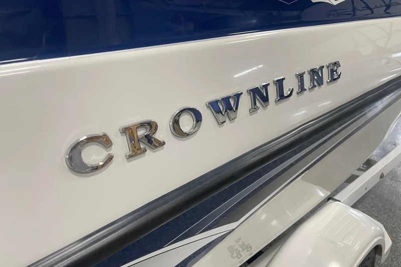 Slide: The Image of 2002 Crownline 180 BR boat with chrome lettering on the side. - 10