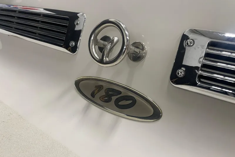 Slide: The Image of Close-up of 2002 Crownline 180 BR boat emblem and chrome details. - 11