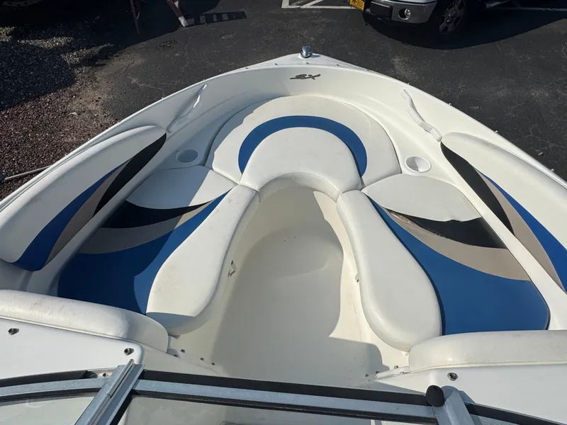 Slide: The Image of 2003 Glastron SX 195 boat interior with blue and white seating. - 10