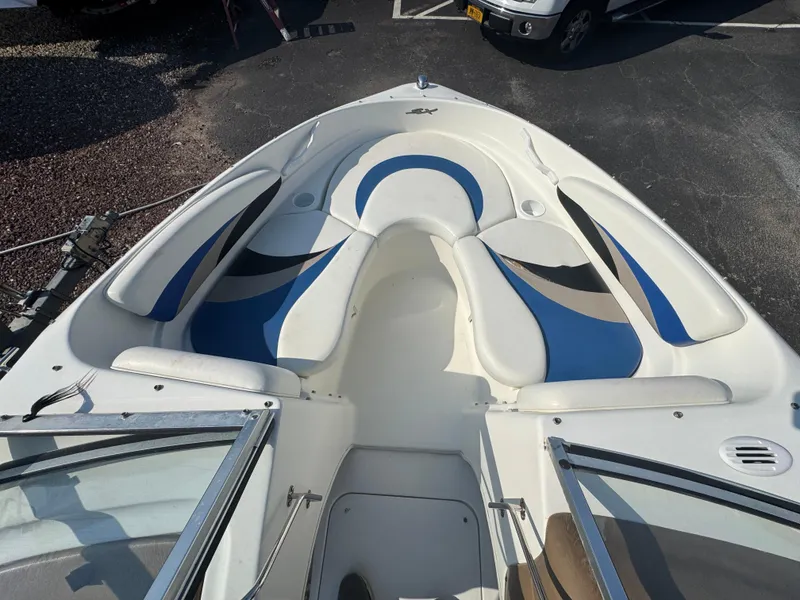 Slide: The Image of 2003 Glastron SX 195 boat interior with blue and white seating. - 16