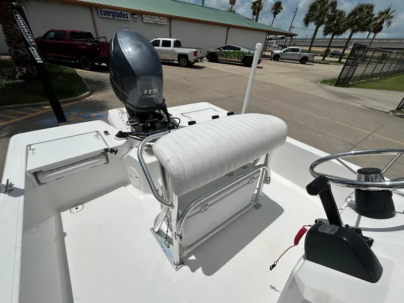 Slide: The Image of 2012 Blue Wave 1900 STL boat with Yamaha 115 engine, parked near Everglades building. - 13