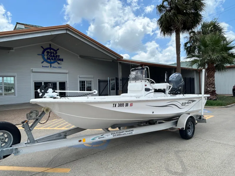 Slide: The Image of 2012 Blue Wave 1900 STL boat on trailer at Gulf Coast Marine dealership. - 2