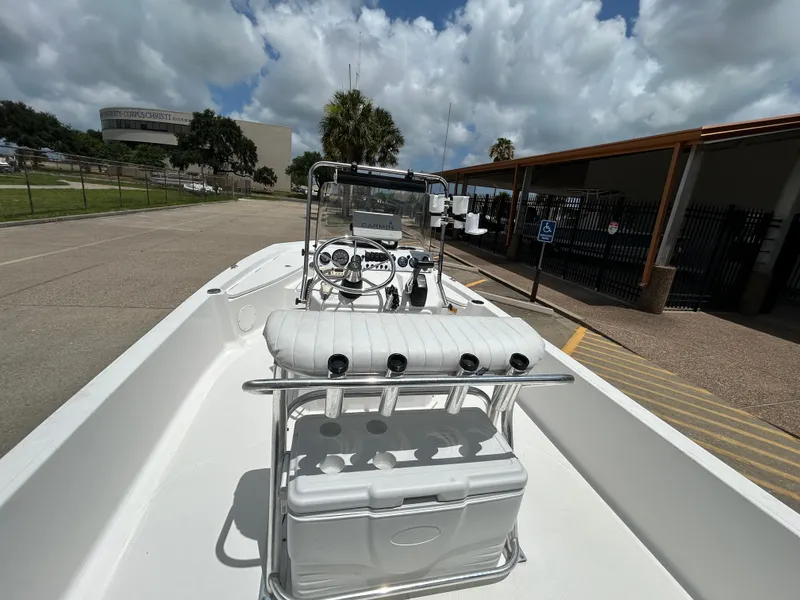 Slide: The Image of 2012 Blue Wave 1900 STL boat parked outdoors under cloudy sky. - 9