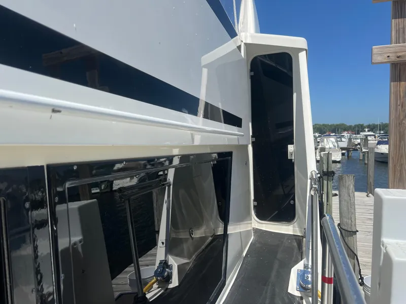 Slide: The Image of 1995 Viking Sports Yacht docked at marina, showcasing sleek design and modern features. - 12