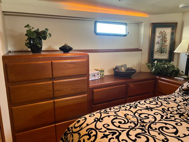 Slide: The Image of Luxurious 1995 Viking Sports Yacht interior with elegant wood cabinetry and decorative accents. - 30