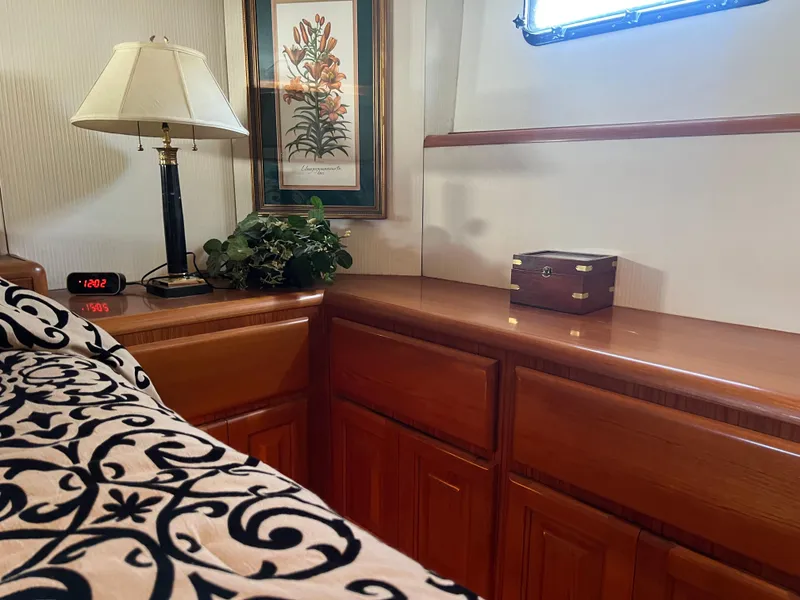 Slide: The Image of Interior of a 1995 Viking Sports Yacht with elegant wood cabinetry and decor. - 31