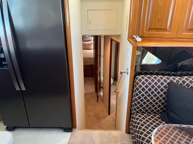 Slide: The Image of Interior of a 1995 Viking Sports Yacht with stairs leading to a bedroom. - 35