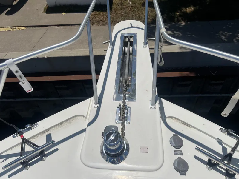 Slide: The Image of Bow of a 1995 Viking Sports Yacht with anchor chain and railing. - 7
