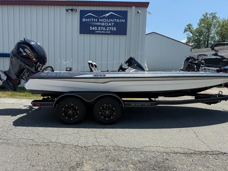 The Image of 2026 Skeeter ZXE20 boat on trailer at Smith Mountain Boat dealership. - 1