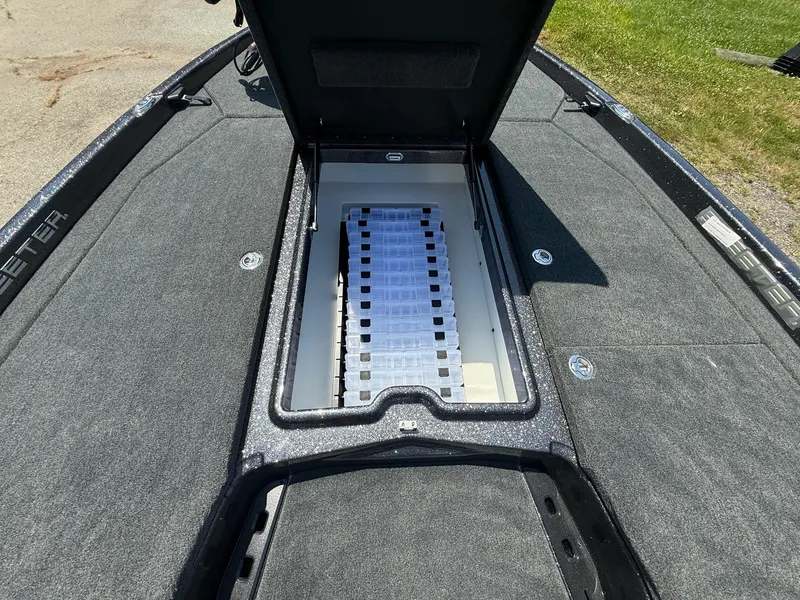 Slide: The Image of 2026 Skeeter ZXE20 boat with open storage compartment on deck. - 13