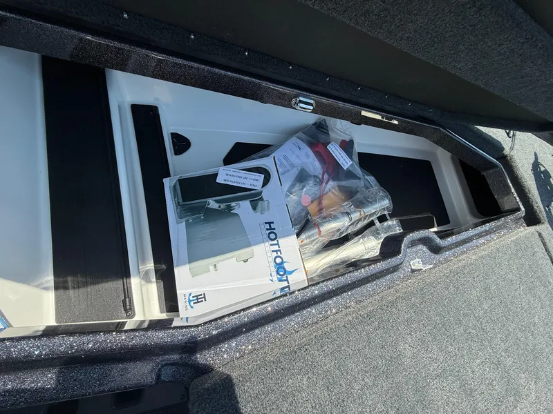 Slide: The Image of Storage compartment of 2026 Skeeter ZXE20 boat with accessories and equipment. - 16