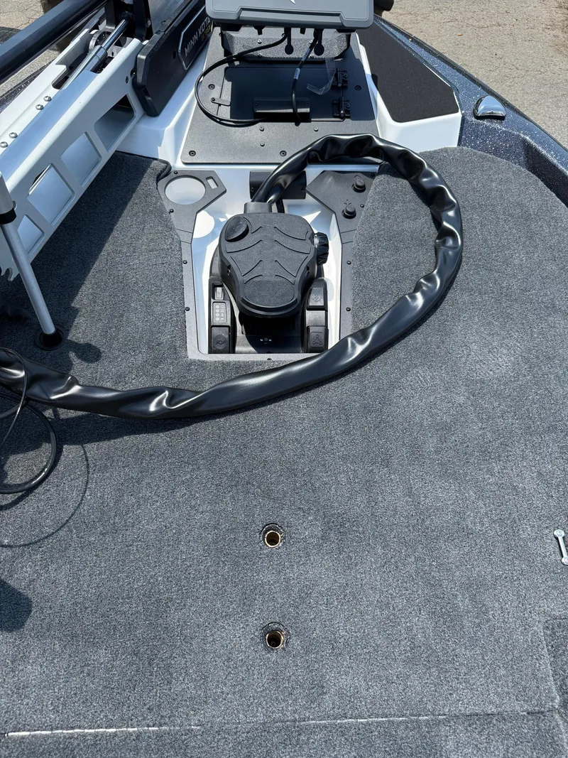 Slide: The Image of Front deck of 2026 Skeeter ZXE20 boat with trolling motor and control panel. - 18