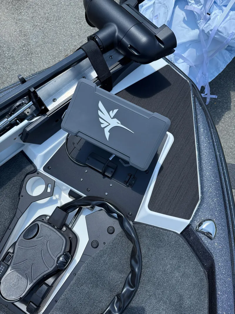 Slide: The Image of 2026 Skeeter ZXE20 boat deck with control panel and storage compartment. - 19