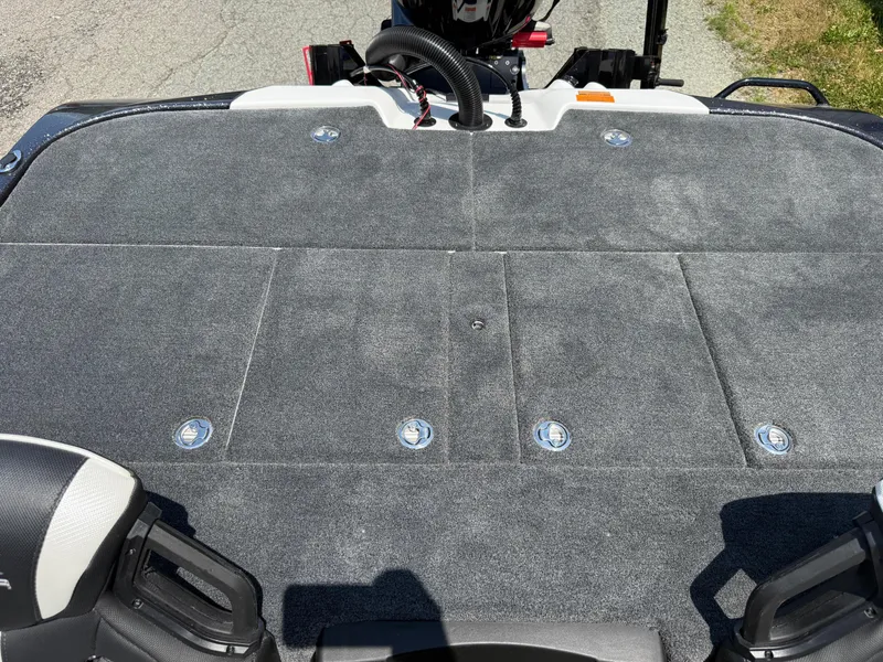 Slide: The Image of 2026 Skeeter ZXE20 boat deck with gray carpet and storage compartments. - 22