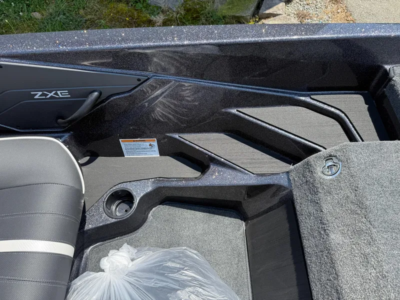 Slide: The Image of Interior of 2026 Skeeter ZXE20 boat showing seating and storage area. - 23