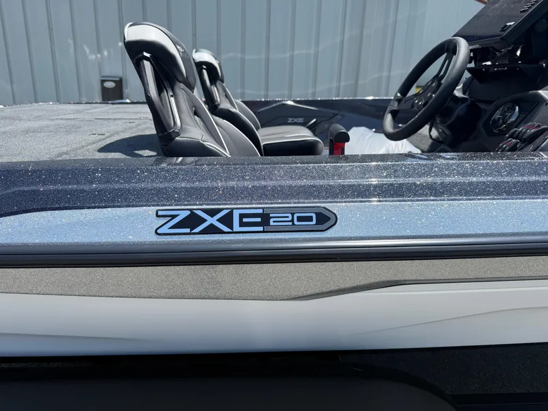 Slide: The Image of 2026 Skeeter ZXE20 boat interior with steering wheel and seats. - 3