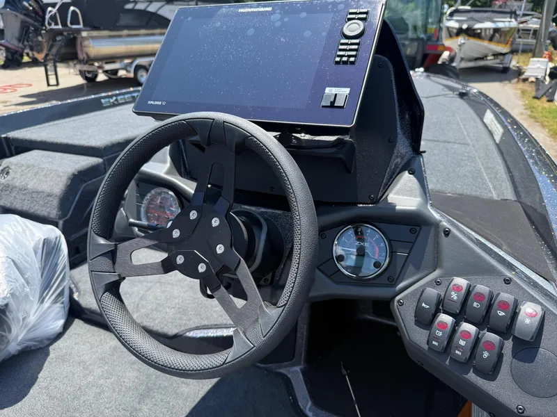 Slide: The Image of Steering console of 2026 Skeeter ZXE20 boat with digital display and control panel. - 4