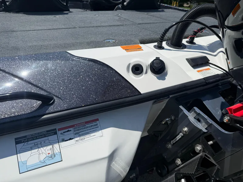 Slide: The Image of 2026 Skeeter ZXE20 boat deck with control panel and safety instructions. - 6