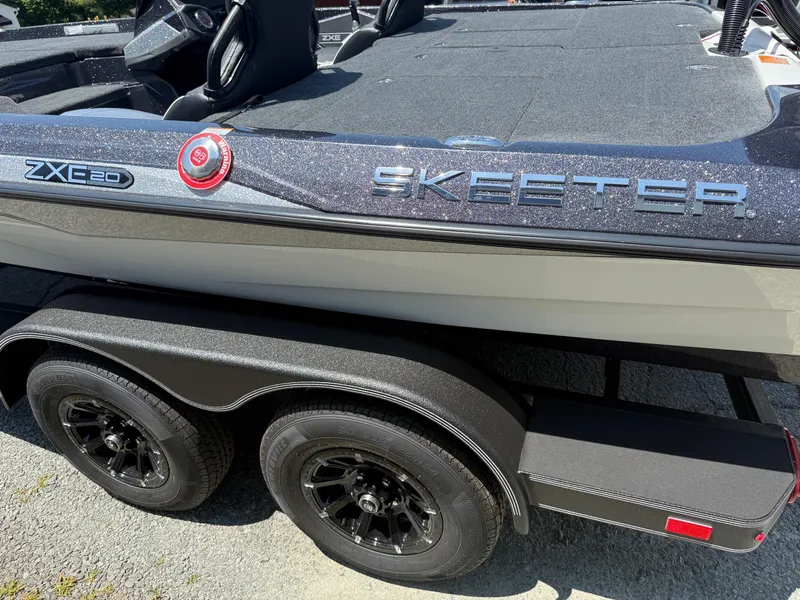 Slide: The Image of 2026 Skeeter ZXE20 boat on trailer, showcasing sleek design and branding. - 7