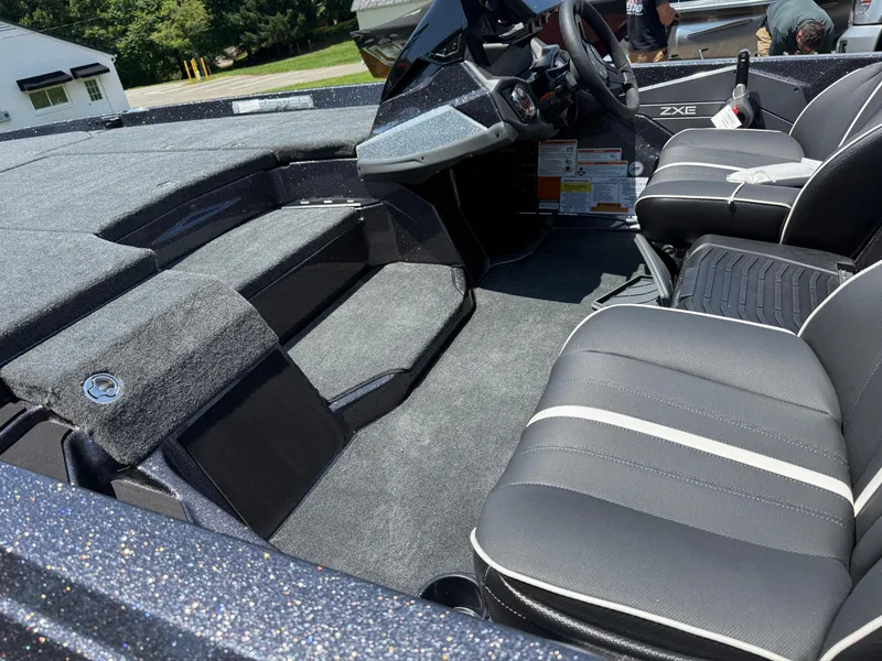 Slide: The Image of 2026 Skeeter ZXE20 boat interior with sleek seating and modern dashboard design. - 9