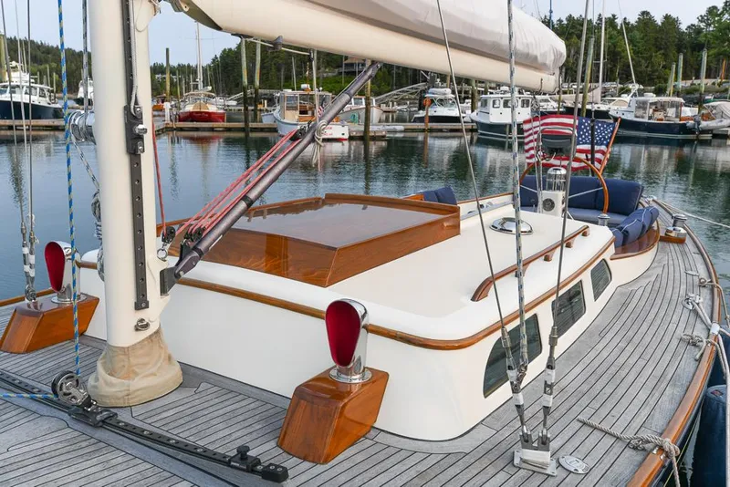 Slide: The Image of 2006 Morris M36 Daysailer docked in marina, featuring elegant wooden deck and classic design. - 14