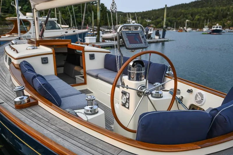 Slide: The Image of 2006 Morris M36 Daysailer with elegant cockpit and scenic marina backdrop. - 21