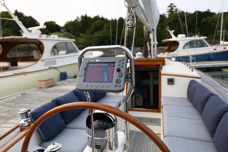 Slide: The Image of 2006 Morris M36 Daysailer with navigation system, docked with other boats in the background. - 26