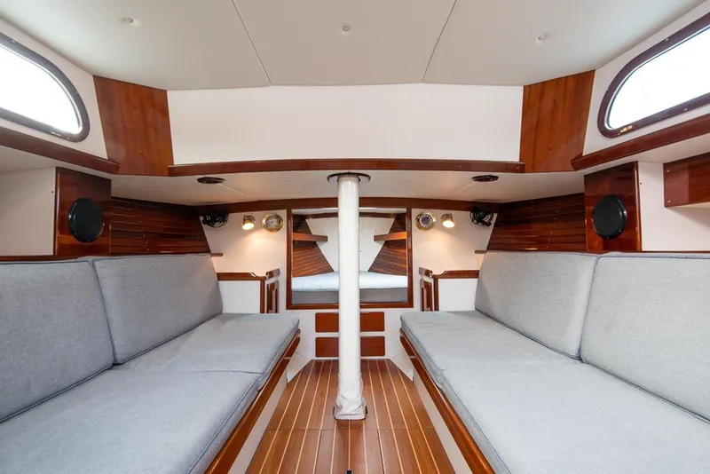 Slide: The Image of Interior of 2006 Morris M36 Daysailer with wooden accents and gray seating. - 32