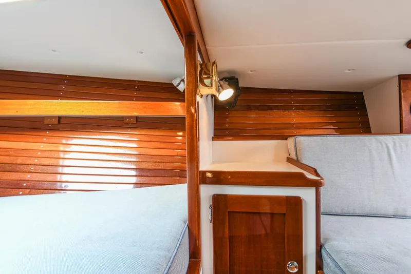 Slide: The Image of Interior of 2006 Morris M36 Daysailer with wooden paneling and cushioned seating. - 34
