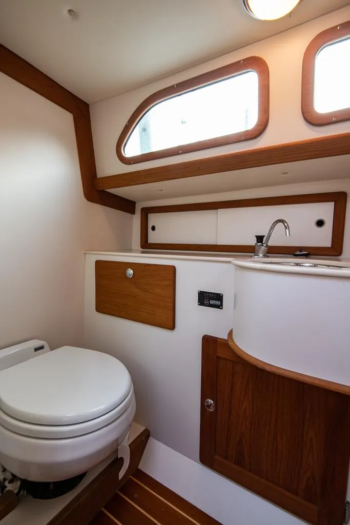 Slide: The Image of 2006 Morris M36 Daysailer bathroom with wooden accents and compact design. - 37