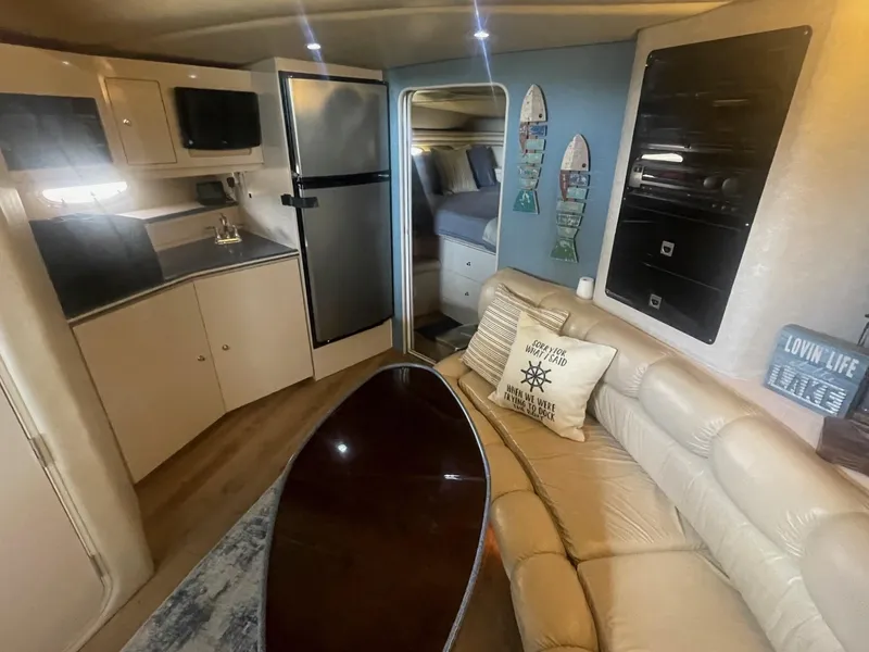 Slide: The Image of Interior of 1996 Regal Commodore 402 yacht with kitchen, seating, and decor. - 11