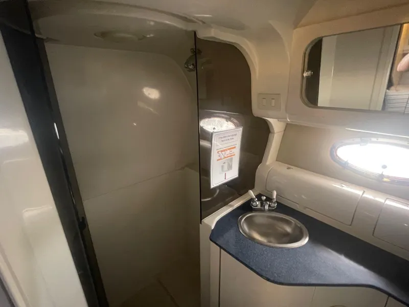 Slide: The Image of Bathroom interior of 1996 Regal Commodore 402 yacht with sink and mirror. - 16
