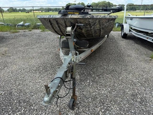 Slide: The Image of 2015 Ranger 1862 CC boat on trailer, parked on gravel lot. - 4