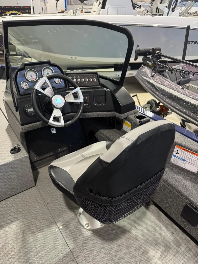 Slide: The Image of 2024 G3 AV18SF VINYL boat cockpit with steering wheel and dashboard controls. - 10