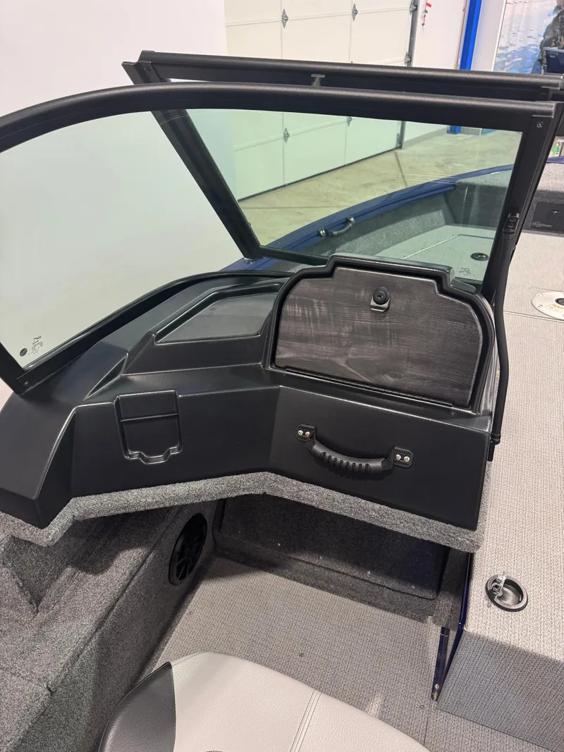 Slide: The Image of 2024 G3 AV18SF VINYL boat interior with open storage compartment and seating. - 14