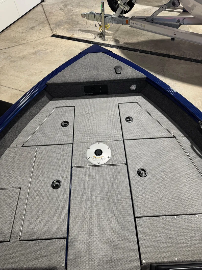 Slide: The Image of 2024 G3 AV18SF VINYL boat deck with storage compartments and gray carpeting. - 17