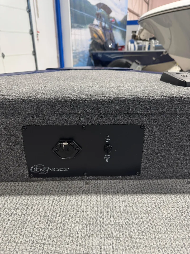 Slide: The Image of 2024 G3 AV18SF boat interior with control panel and carpeted surface. - 19