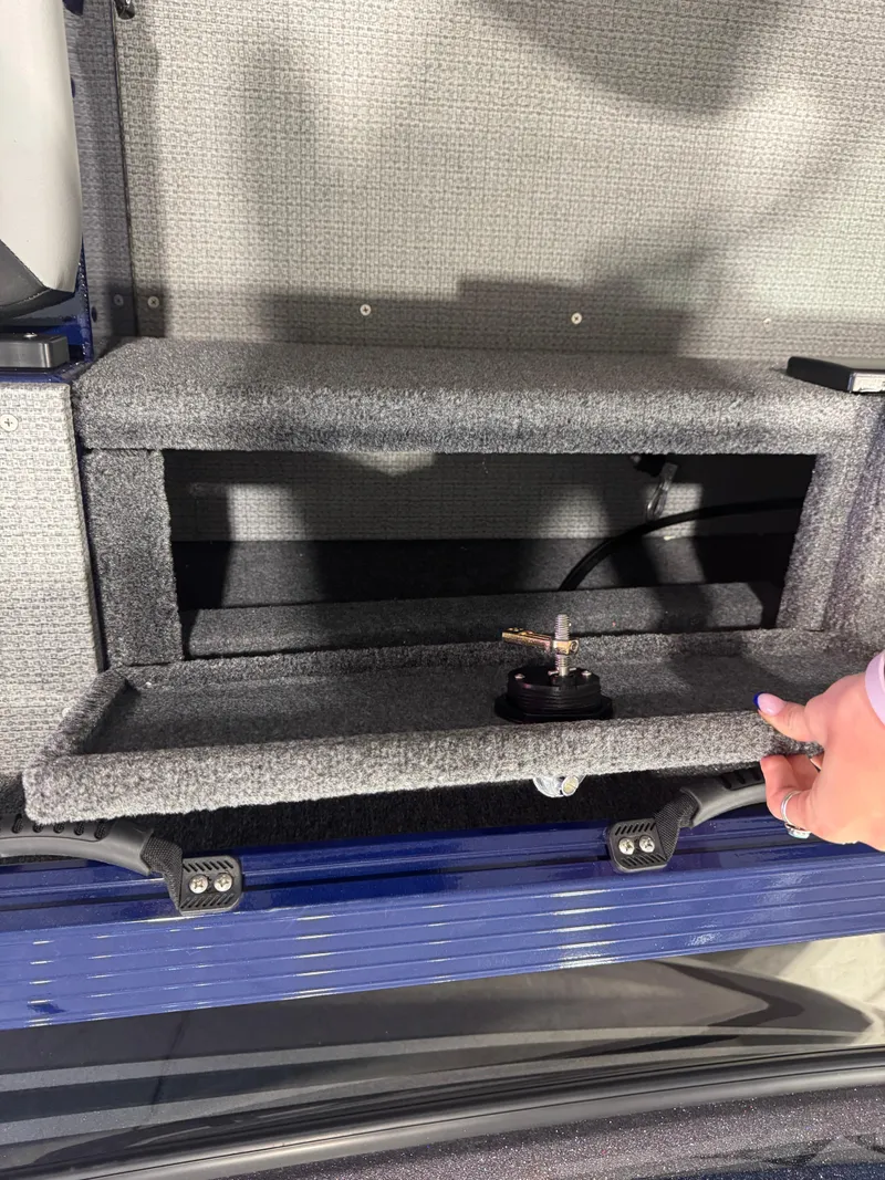 Slide: The Image of 2024 G3 AV18SF VINYL boat storage compartment with open hatch and visible wiring. - 6