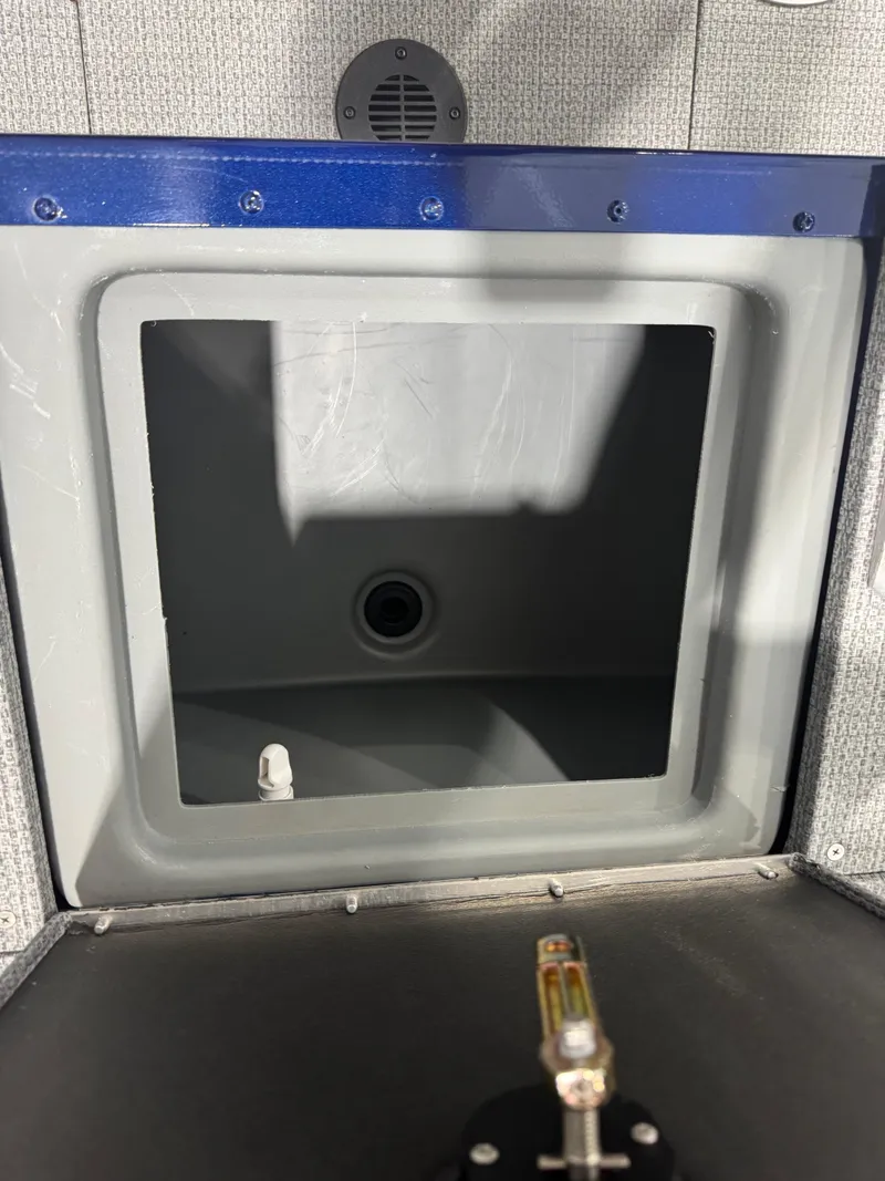 Slide: The Image of 2024 G3 AV18SF VINYL boat compartment with gray interior and blue trim. - 7