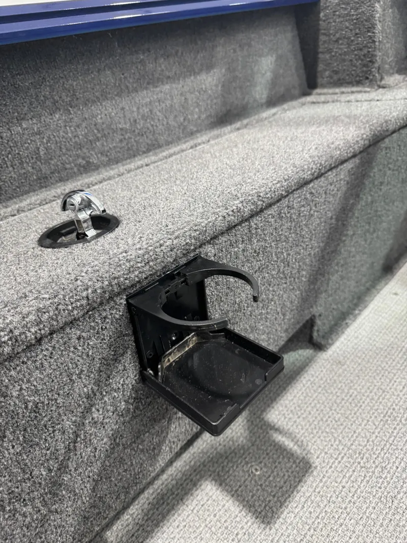 Slide: The Image of 2024 G3 AV18SF VINYL boat interior with foldable cup holder and carpeted surface. - 9
