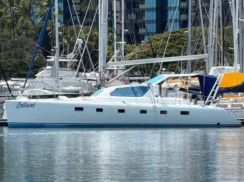 The Image of Luxury performance yacht docked in marina, 2005 model, surrounded by other boats. - 0