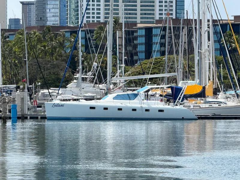 Slide: The Image of Luxury yacht docked in marina with cityscape background, 2005 custom model. - 2