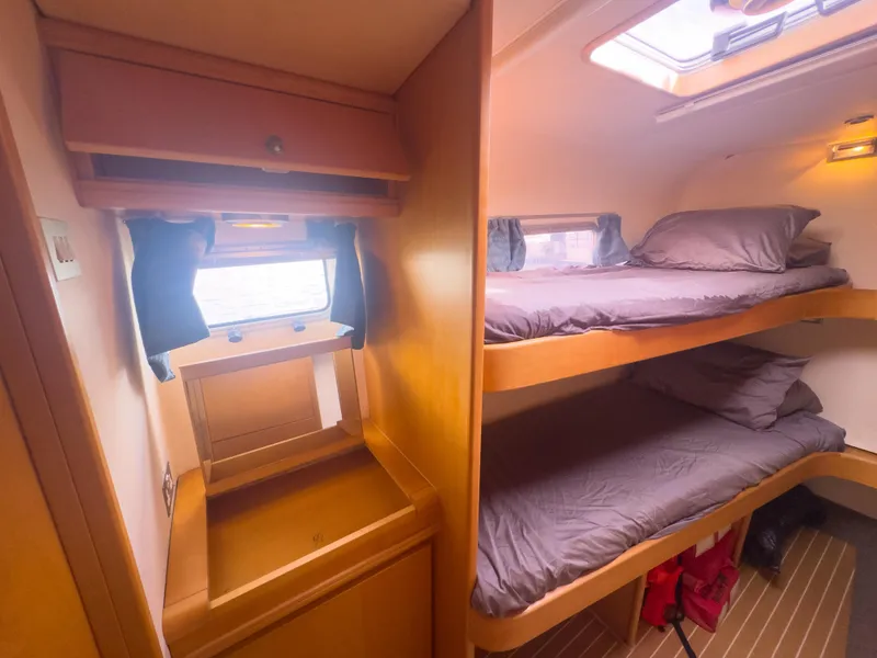 Slide: The Image of Luxurious 2005 custom yacht cabin with bunk beds and wooden interior. - 22