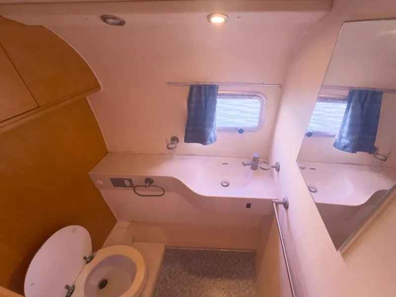 Slide: The Image of Luxury yacht bathroom with sink, toilet, mirror, and window, 2005 custom model. - 24