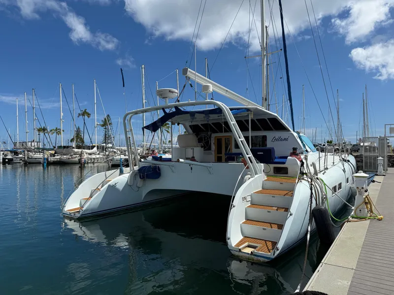 Slide: The Image of Luxury catamaran docked at marina, 2005 Custom model, clear blue sky, calm water. - 26