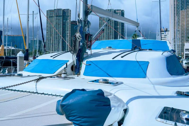 Slide: The Image of Luxury performance yacht docked in marina, city skyline in background, 2005 model. - 4