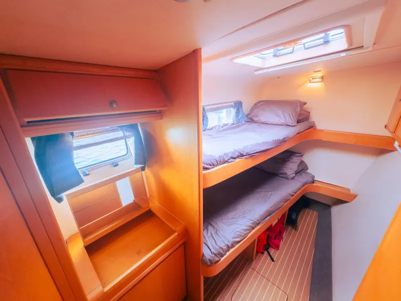 Slide: The Image of Luxurious 2005 custom yacht cabin with bunk beds and wooden interior. - 9