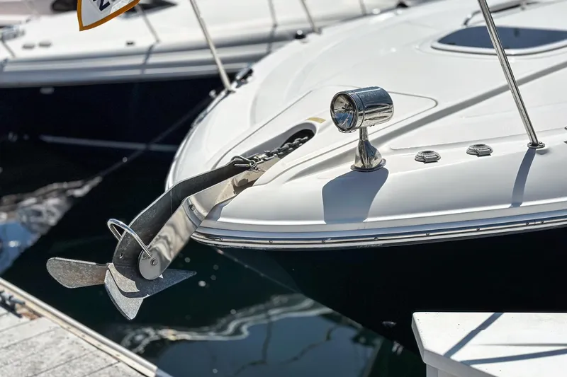 Slide: The Image of 2007 Sea Ray 310 Sundancer boat with anchor and spotlight at dock. - 2