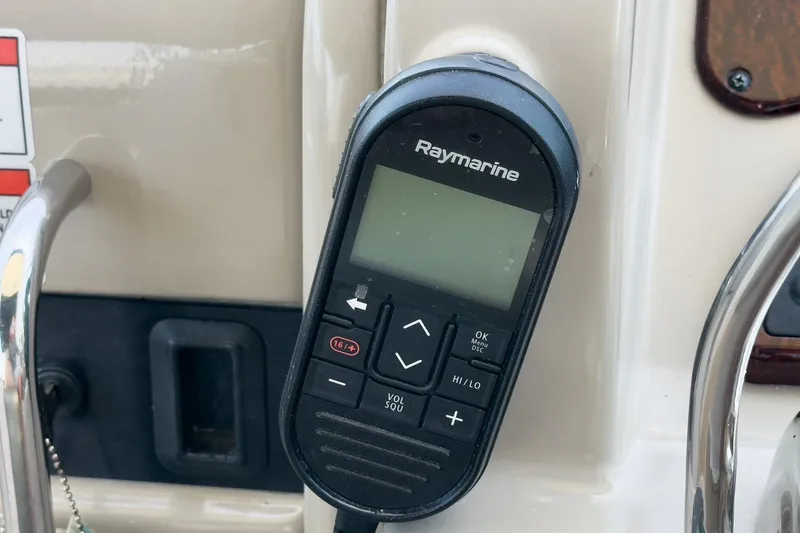 Slide: The Image of Raymarine marine radio on 2007 Sea Ray 310 Sundancer boat dashboard. - 21