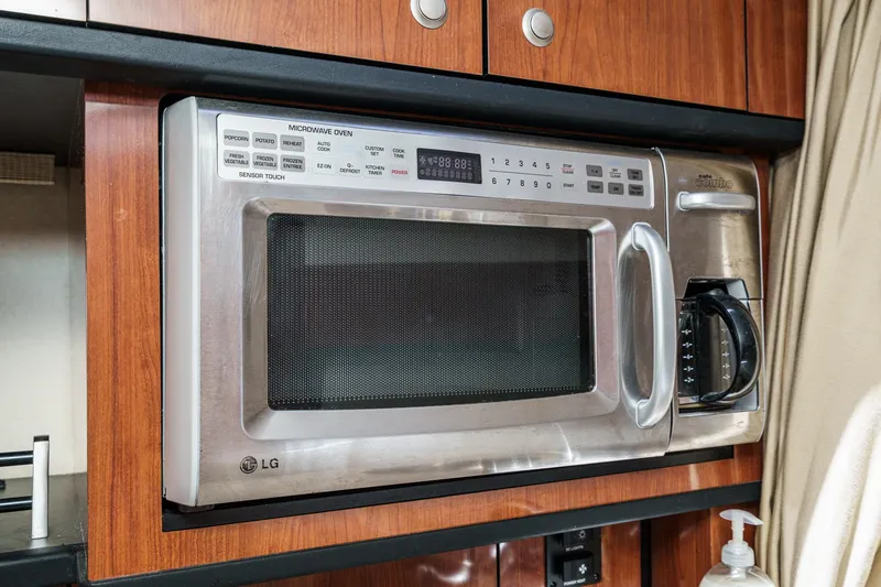 Slide: The Image of LG microwave oven in a 2007 Sea Ray 310 Sundancer yacht kitchen. - 27
